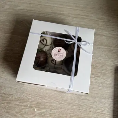 A small ribbon-tied window gift box.