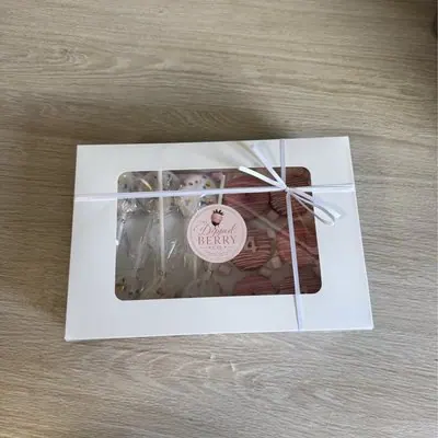 A small ribbon-tied window gift box.