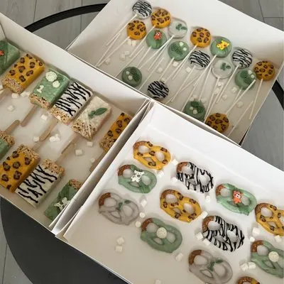 Safari animal-print cake pops, krispie squares and pretzels.