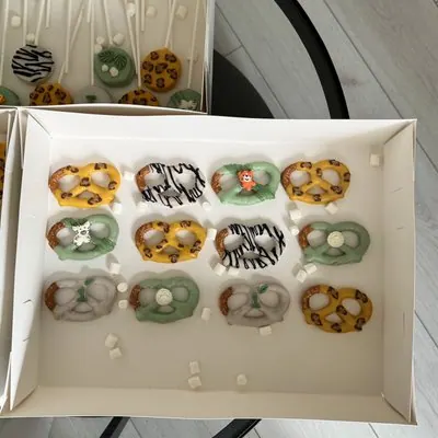 Chocolate-dipped pretzels in a safari animal-print theme.